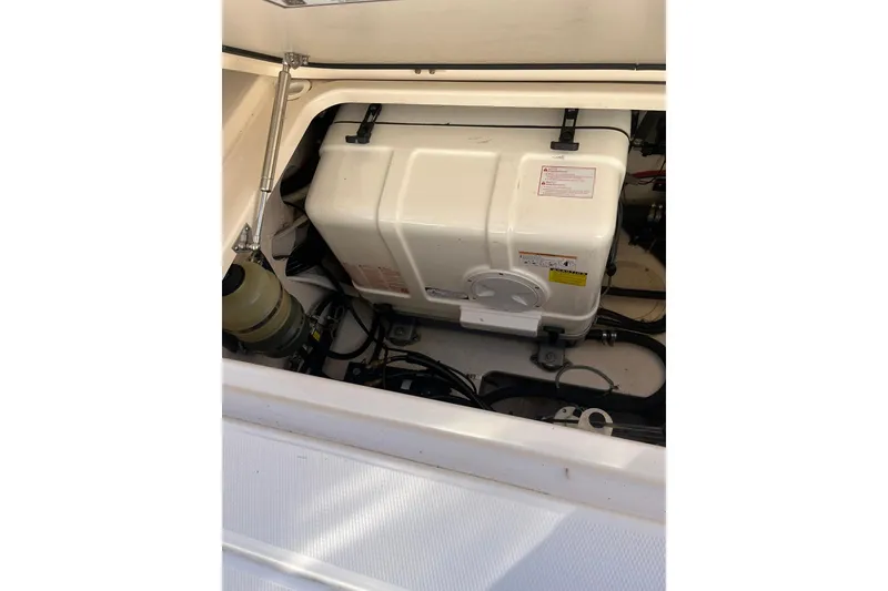 Slide: The Image of Engine compartment of 2015 Grady-White Freedom 375 boat, showcasing generator and components. - 20