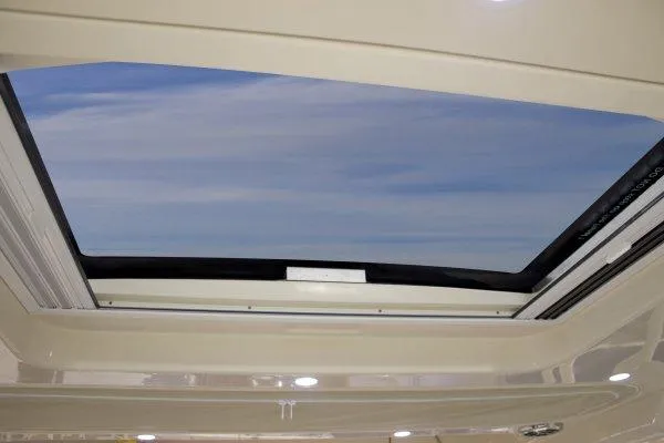 Slide: The Image of Manufacturer Provided Image: Sunroof view from 2015 Grady-White Freedom 375 boat, showcasing clear blue sky. - 22