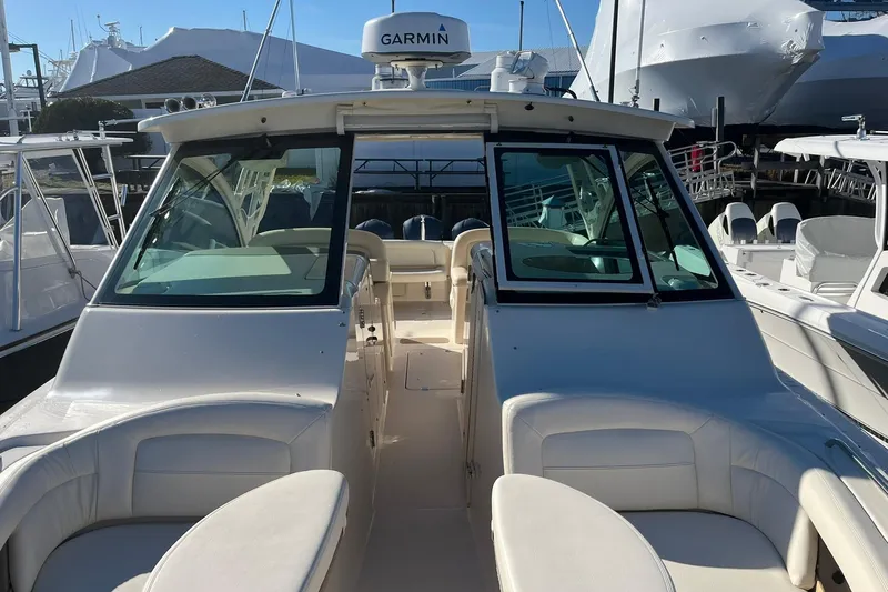 Slide: The Image of 2015 Grady-White Freedom 375 boat with Garmin equipment, docked in a marina. - 3
