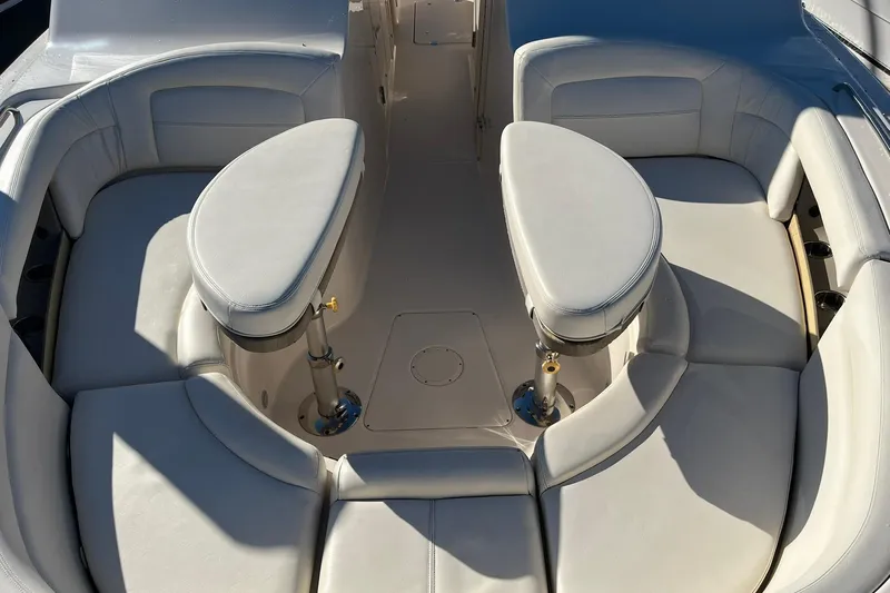 Slide: The Image of 2015 Grady-White Freedom 375 boat interior with cushioned seating and dual tables. - 5