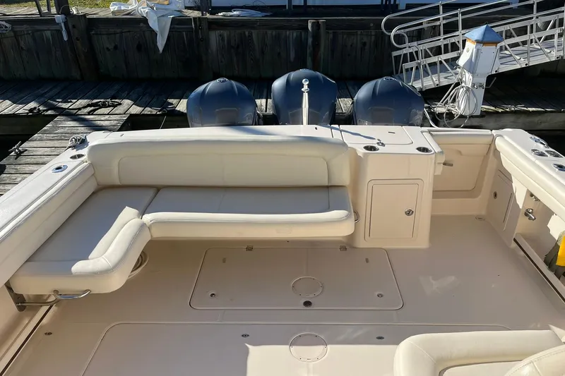 Slide: The Image of 2015 Grady-White Freedom 375 boat interior with seating and outboard motors. - 6