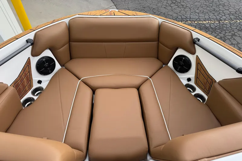 Slide: The Image of 2026 Moomba Mondo boat interior with tan leather seating and built-in speakers. - 6