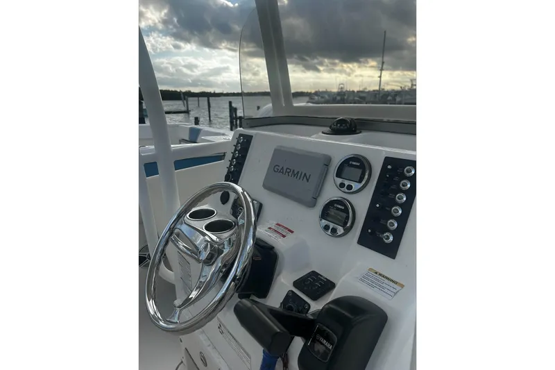 Slide: The Image of 2016 Robalo R222 Center Console boat dashboard with Garmin navigation system. - 5