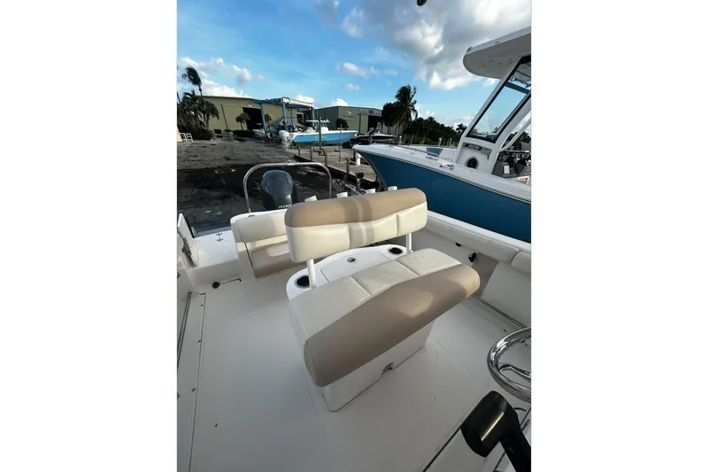 Slide: The Image of 2016 Robalo R222 Center Console boat interior with seating and console view. - 6