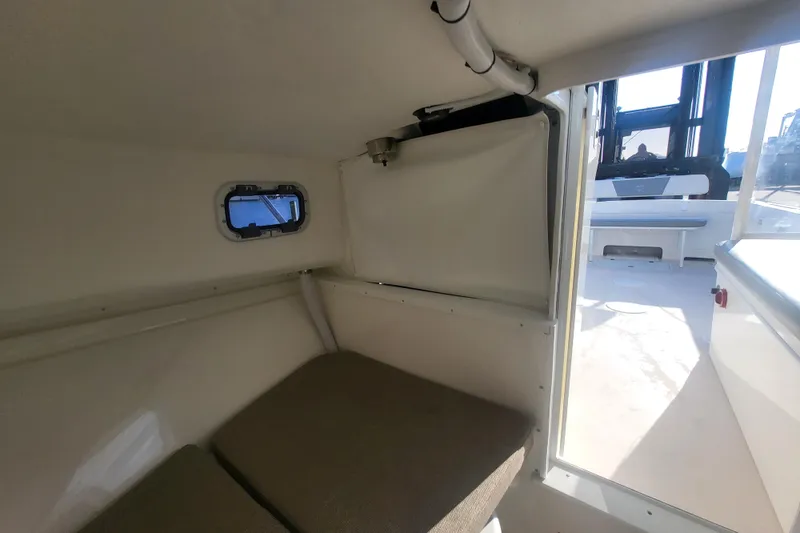 Slide: The Image of 2021 Steiger Craft 255 DV MIAMI cabin interior with window and seating area. - 20