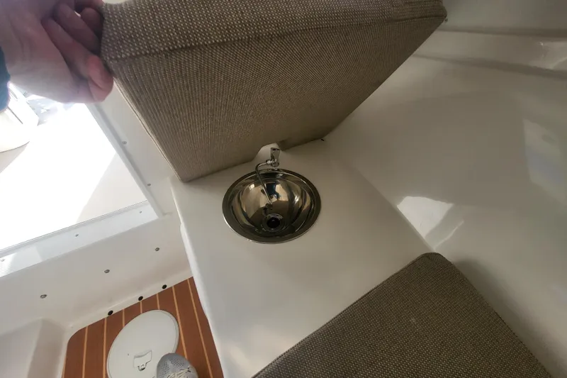 Slide: The Image of 2021 Steiger Craft 255 DV MIAMI boat interior with hidden sink under seat cushion. - 23