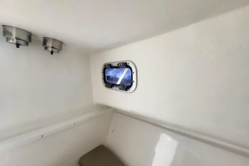 Slide: The Image of Interior cabin of 2021 Steiger Craft 255 DV MIAMI with porthole and lighting fixtures. - 24
