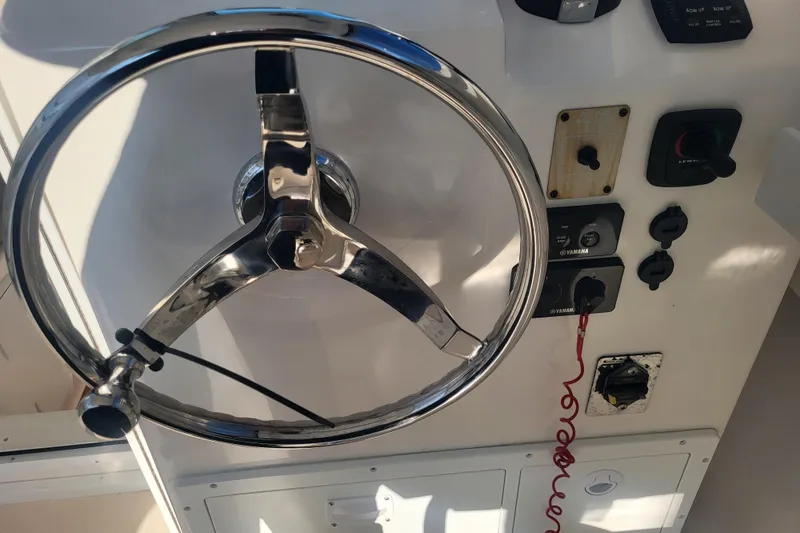 Slide: The Image of Steering wheel and controls of 2021 Steiger Craft 255 DV MIAMI boat. - 39