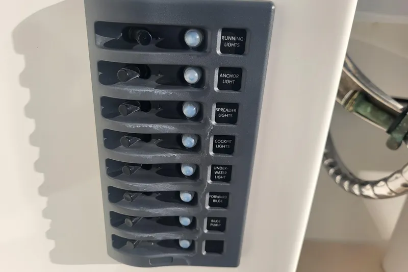 Slide: The Image of Control panel of 2021 Steiger Craft 255 DV MIAMI boat with labeled switches for various lights. - 41