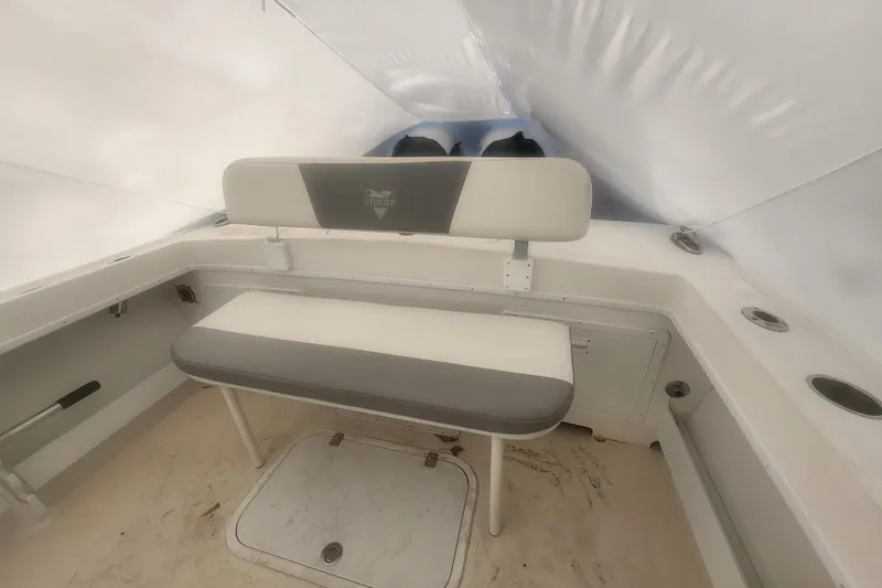 Slide: The Image of 2021 Steiger Craft 255 DV MIAMI boat named "Murray's Lure" in a marina setting. - 5