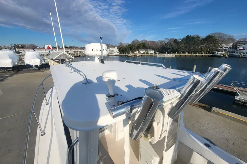 Slide: The Image of 2021 Steiger Craft 255 DV MIAMI boat docked, featuring Garmin equipment under a clear blue sky. - 50