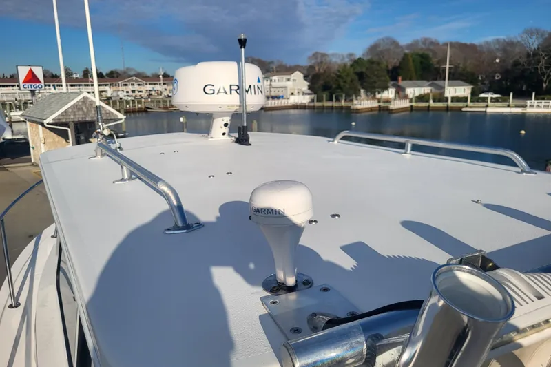 Slide: The Image of 2021 Steiger Craft 255 DV MIAMI boat with Garmin equipment, docked near waterfront homes. - 51