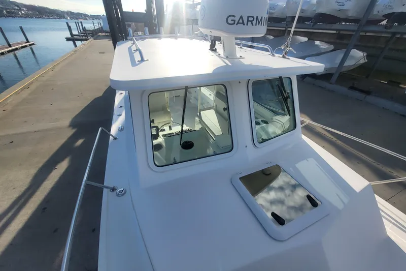 Slide: The Image of 2021 Steiger Craft 255 DV MIAMI boat docked, featuring Garmin equipment and sleek design. - 59