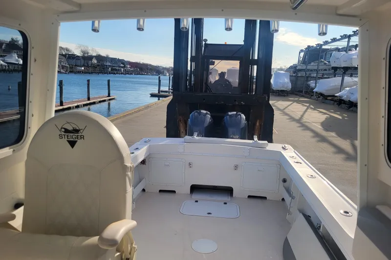 Slide: The Image of 2021 Steiger Craft 255 DV MIAMI boat interior with dockside view and forklift. - 64