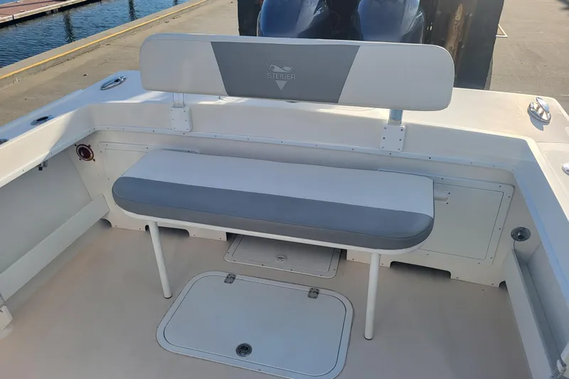 Slide: The Image of 2021 Steiger Craft 255 DV MIAMI boat seating area with storage compartments. - 65