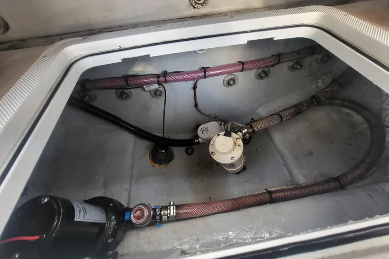 Slide: The Image of 2021 Steiger Craft 255 DV MIAMI boat interior with visible plumbing and wiring. - 84