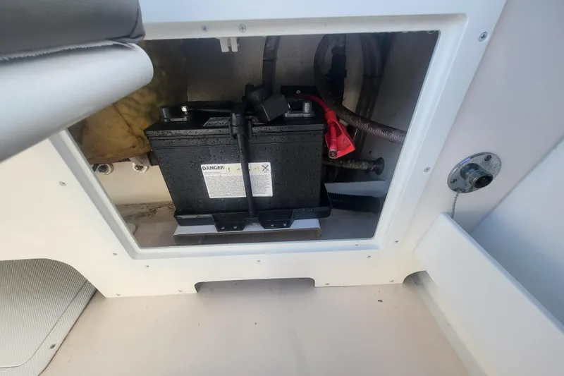 Slide: The Image of Battery compartment of 2021 Steiger Craft 255 DV MIAMI boat, showing wiring and connections. - 87