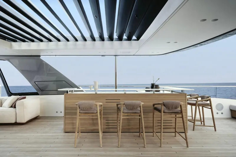 Slide: The Image of Luxurious Sanlorenzo SD132 yacht deck with bar and seating, 2028 model. - 22