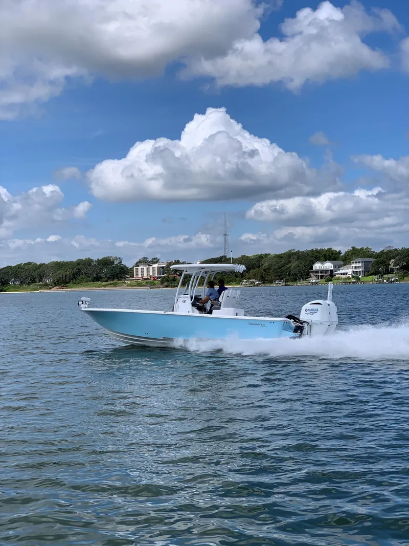 The Image of Tidewater 2700 Carolina Bay 2020 boat cruising on water under blue sky. - 0