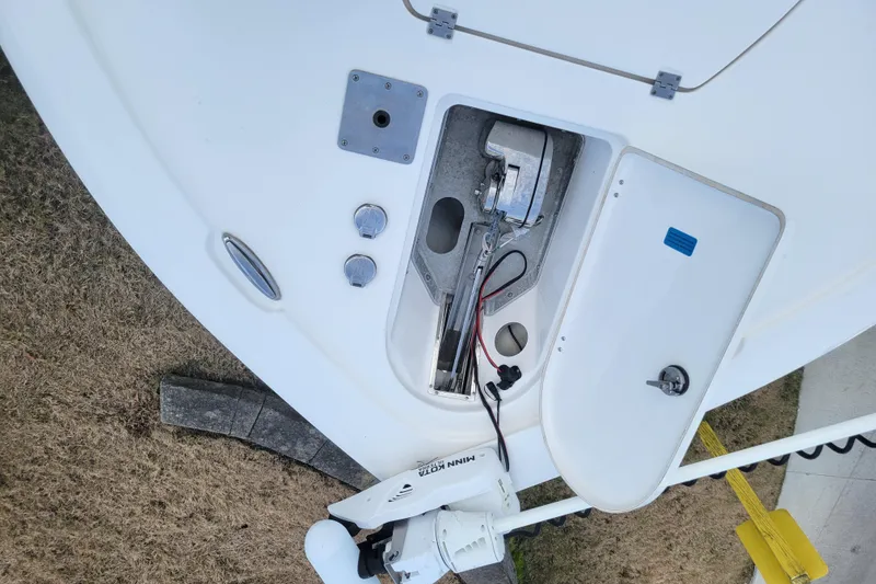 Slide: The Image of 2020 Tidewater 2700 Carolina Bay boat anchor compartment with Minn Kota trolling motor. - 13