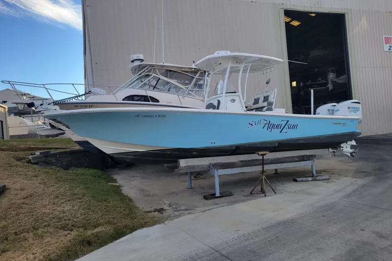 Slide: The Image of 2020 Tidewater 2700 Carolina Bay boat on display outside a warehouse. - 4