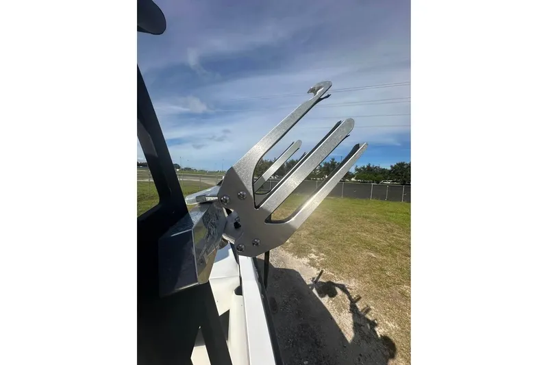 Slide: The Image of Wakeboard rack on a 2012 Axis A20 boat under a clear blue sky. - 10