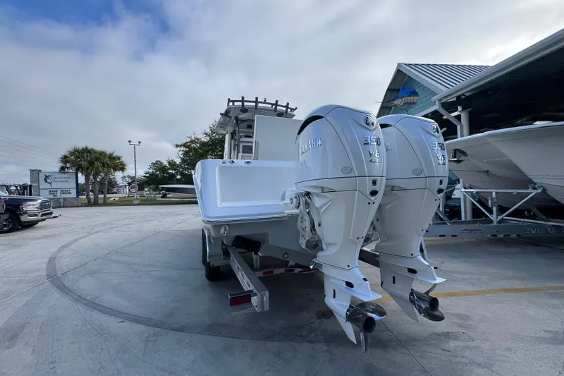 Slide: The Image of 2026 Solace 30 CS boat with dual Yamaha 350 V6 engines in a marina setting. - 15