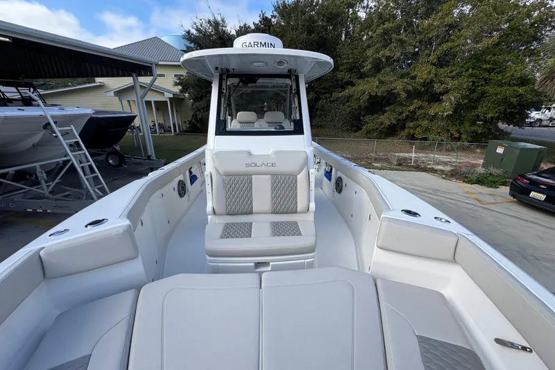 Slide: The Image of 2026 Solace 30 CS boat with spacious seating and modern design. - 22
