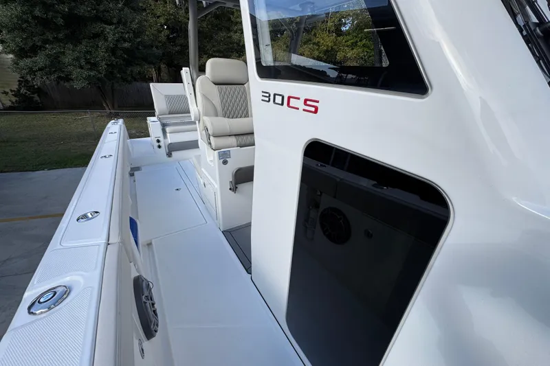 Slide: The Image of 2026 Solace 30 CS boat interior with seating and sleek design. - 24