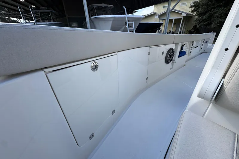 Slide: The Image of 2026 Solace 30 CS boat interior with sleek storage compartments and modern design. - 25