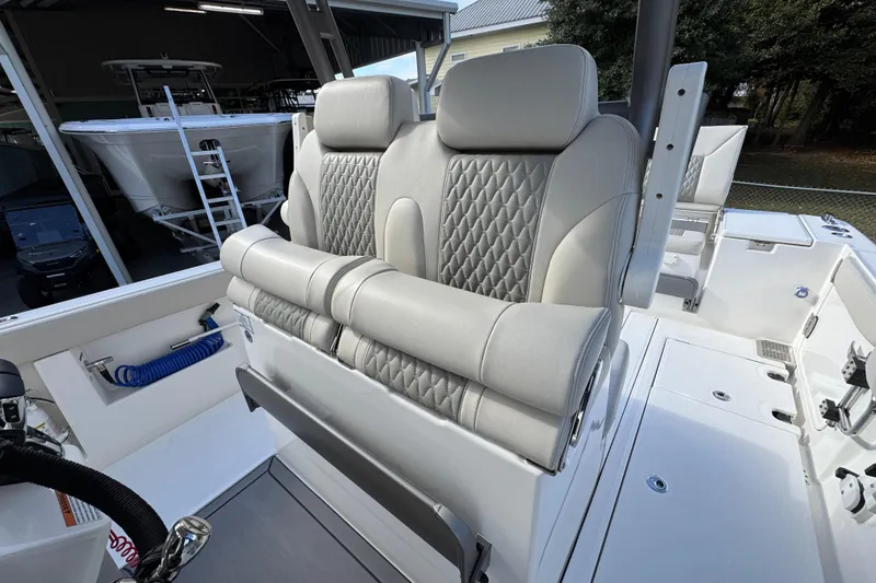 Slide: The Image of Luxurious seating on 2026 Solace 30 CS boat with quilted upholstery. - 31