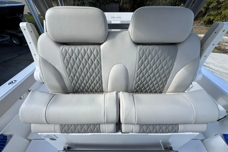 Slide: The Image of Luxurious seating on 2026 Solace 30 CS boat with diamond-patterned upholstery. - 32