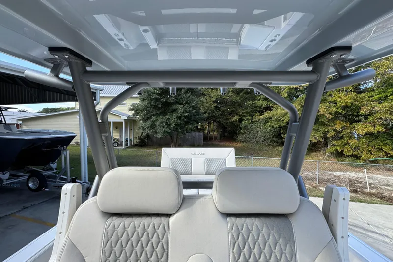 Slide: The Image of Interior view of 2026 Solace 30 CS boat with modern seating and canopy. - 33