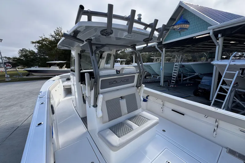 Slide: The Image of 2026 Solace 30 CS boat with sleek design, docked at a marina. - 39
