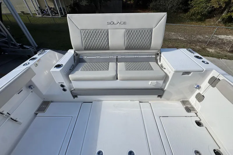 Slide: The Image of 2026 Solace 30 CS boat interior with cushioned seating and storage compartments. - 45