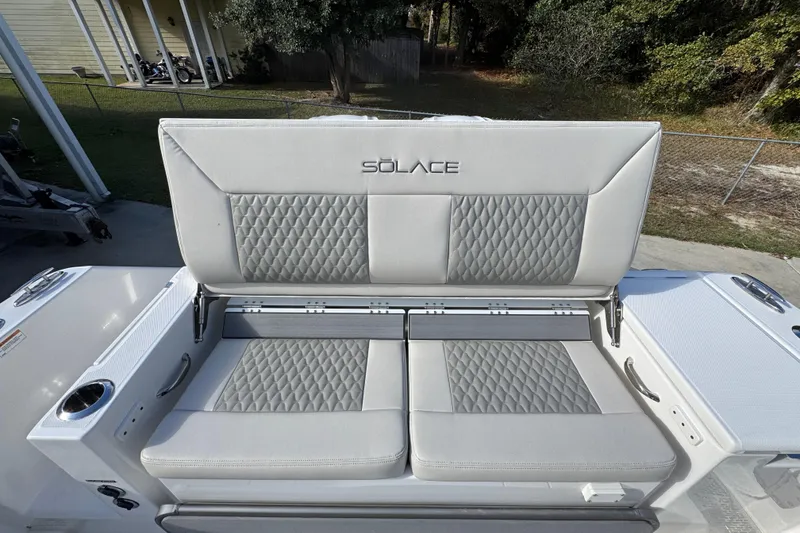 Slide: The Image of 2026 Solace 30 CS boat seating with quilted upholstery and integrated cup holder. - 46