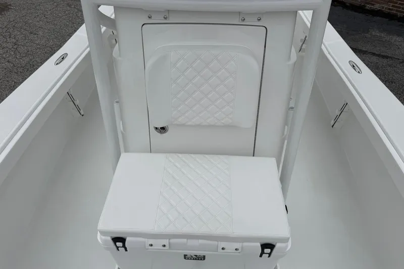 Slide: The Image of 2026 BlackJack 256 Coastal boat interior with white cushioned seating and storage. - 12