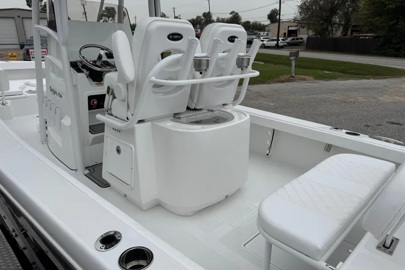 Slide: The Image of 2026 BlackJack 256 Coastal boat interior with seating and steering console. - 18