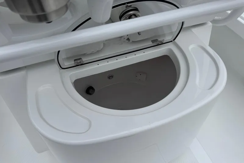 Slide: The Image of Livewell compartment on a 2026 BlackJack 256 Coastal boat, featuring a sleek white design. - 19