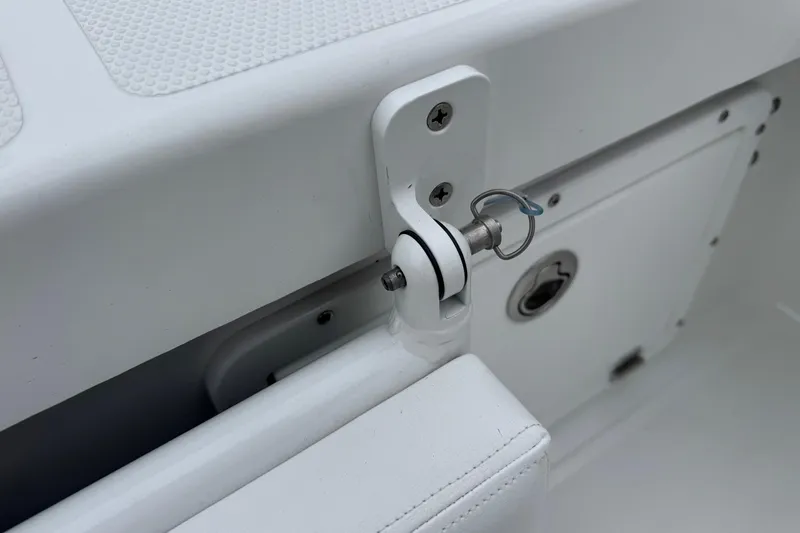 Slide: The Image of Close-up of a 2026 BlackJack 256 Coastal boat hinge and latch mechanism. - 23