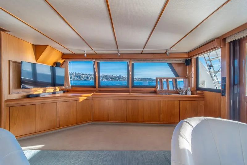Slide: The Image of Luxurious interior of 1991 Tollycraft 57 Pilothouse Motor Yacht with panoramic windows. - 12