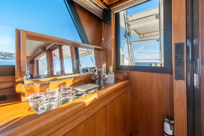 Slide: The Image of Luxurious interior of 1991 Tollycraft 57 Pilothouse Motor Yacht with bar setup. - 13