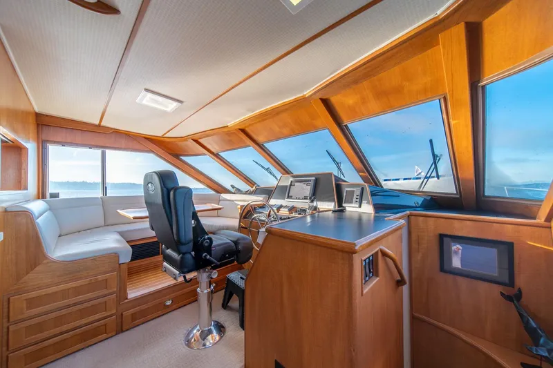 Slide: The Image of Luxurious 1991 Tollycraft 57 Pilothouse Motor Yacht interior with panoramic windows and modern helm. - 17