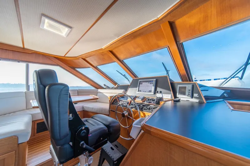 Slide: The Image of Luxurious 1991 Tollycraft 57 Pilothouse Motor Yacht interior with modern navigation equipment. - 18