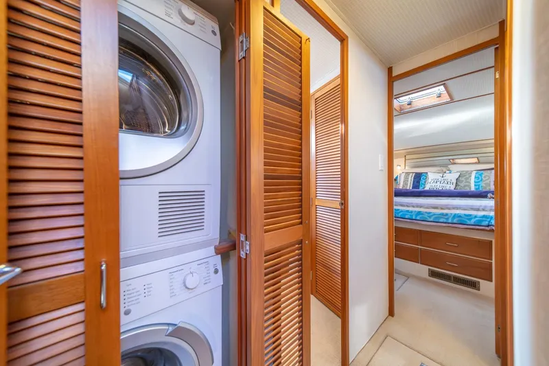 Slide: The Image of Laundry area and bedroom in 1991 Tollycraft 57 Pilothouse Motor Yacht. - 38