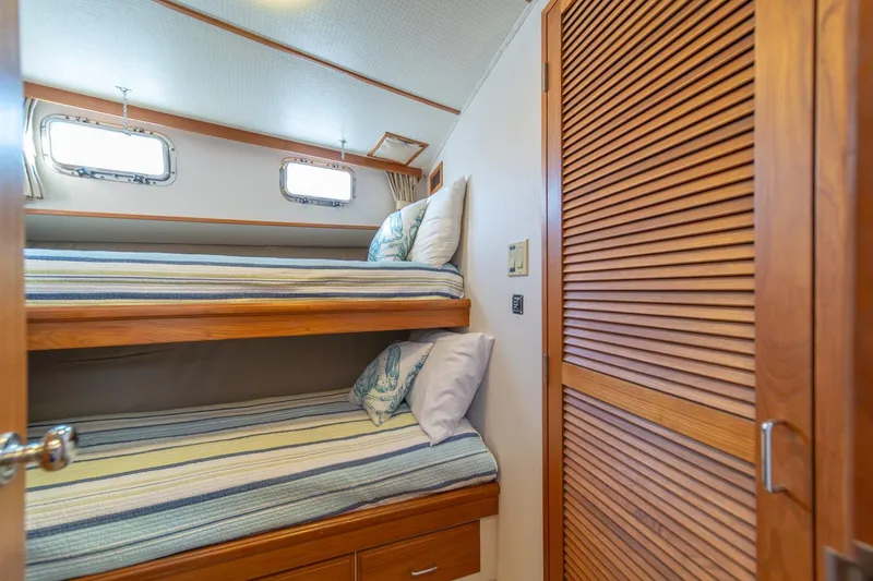 Slide: The Image of Bunk beds in 1991 Tollycraft 57 Pilothouse Motor Yacht cabin with wooden accents. - 39