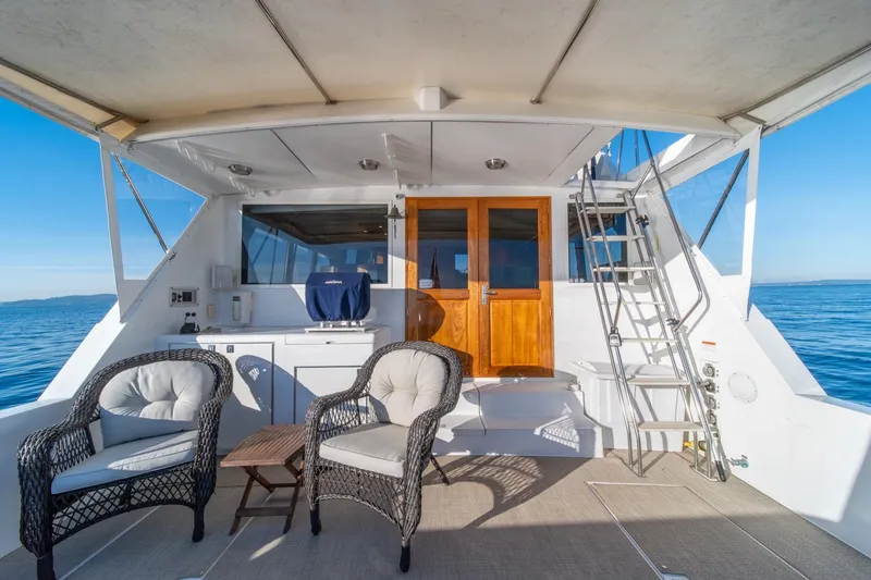 Slide: The Image of 1991 Tollycraft 57 Pilothouse Motor Yacht deck with seating and ocean view. - 44