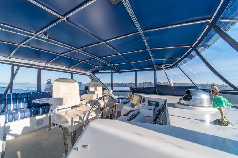 Slide: The Image of Luxurious 1991 Tollycraft 57 Pilothouse Motor Yacht interior with blue canopy and seating. - 51