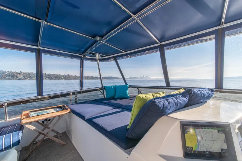 Slide: The Image of Luxurious 1991 Tollycraft 57 Pilothouse Motor Yacht interior with scenic ocean view. - 54