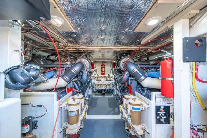 Slide: The Image of Engine room of a 1991 Tollycraft 57 Pilothouse Motor Yacht, showcasing machinery and equipment. - 61